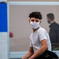 person holding a yellow ball